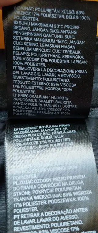 Minifalda negra cuero cremalleras y cadena