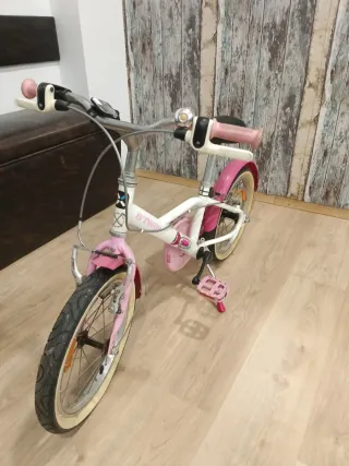 Bicicleta infantil B-Twin rosa y blanca