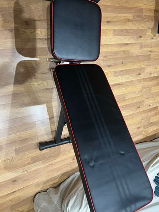 Banco de pesas + barras y mancuernas