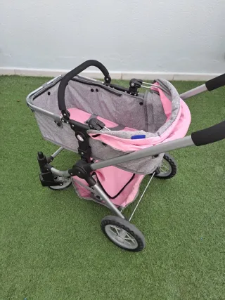 Cochecito de juguete rosa y gris