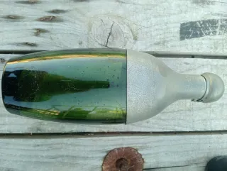 Botellero vintage con 4 bottiglie antiche