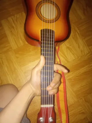 Guitarra con correa