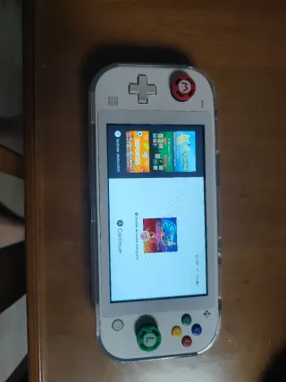 Nintendo switch lite blanca con "juegos"