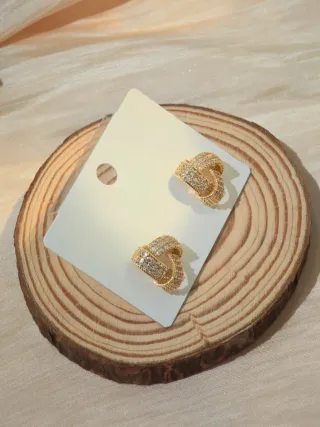 Orecchini nodo dorati con zirconi