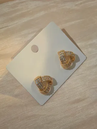 Orecchini nodo dorati con zirconi