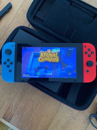 Nintendo Switch + Animal Crossing + funda oficial