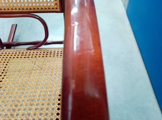 Dolce culla in legno e rattan