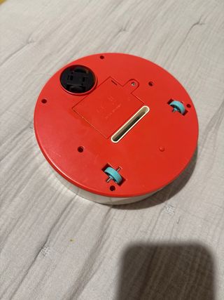 Robot aspirador de juguete redondo blanco y azul