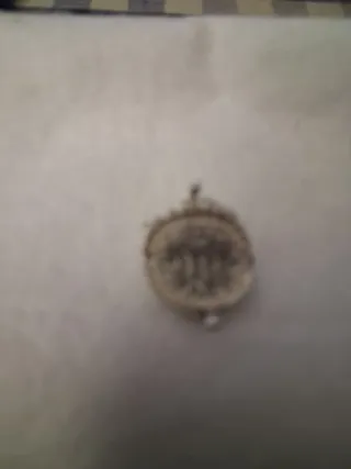 Colgante monedero plateado