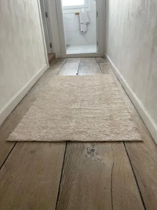 Alfombra beige de tela