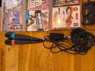 PS3 Slim, 4 mandos, 16 juegos, 2 micrófonos y mas