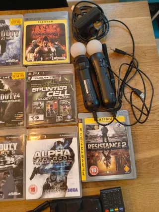 PS3 Slim, 4 mandos, 16 juegos, 2 micrófonos y mas