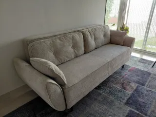Sofá-cama beige de tela