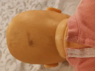 Bambola vintage in tutina rosa