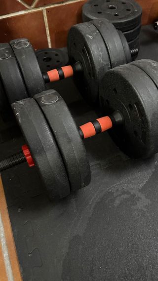 Barra de pesas con discos y agarre