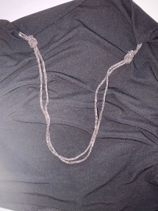 Top negro con detalles en en pedrería