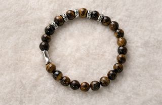 Pulsera bolas elástica color carey y baño de plata