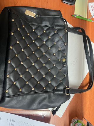 Borsa Conbipel borchie