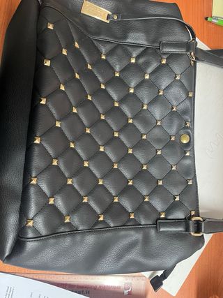 Borsa Conbipel borchie