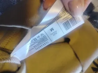 Felpa con stampa graffiti beige e nera