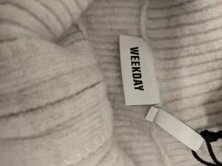 Jersey de punto con cremallera y rayas