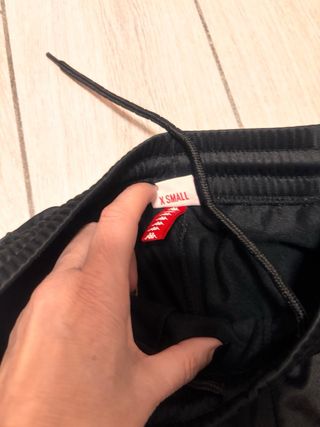 Pantaloni Kappa neri con bottoni laterali