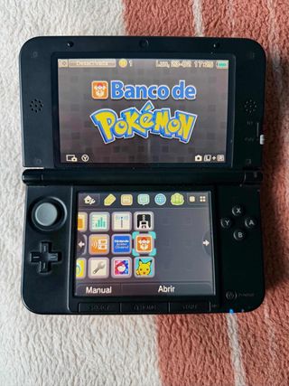 Nintendo 3DS xl roja con banco pokemon IMPOLUTA