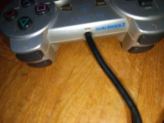 PS2 Oficial Dual Shock 2 Plata Mando