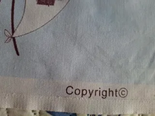 Tela de ¿loneta? con motivos  infantiles.