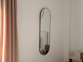 Espejo de pared ovalado negro