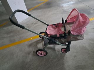 Carrito de bebé de juguete rosa