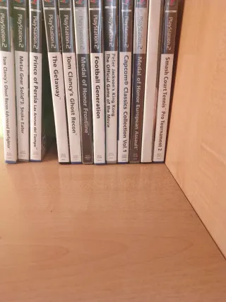 PlayStation 2 Slim Negra + 2 Mandos + 12 Juegos