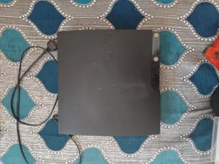Consola PS3 con mando y 3 juegos