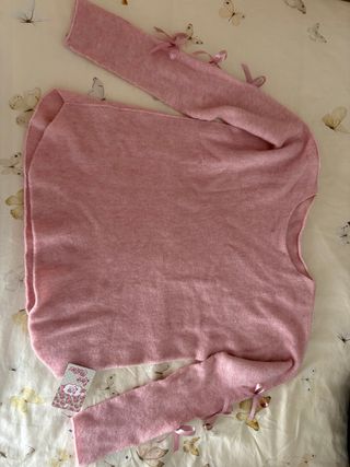 Jersey rosa con lazos en mangas