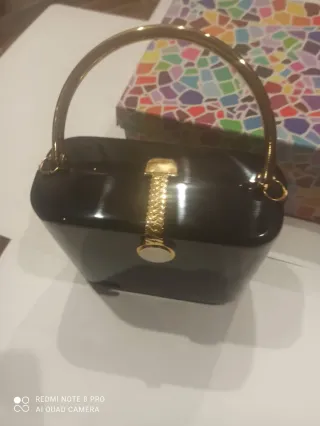 Bolso de fiesta negro y dorado