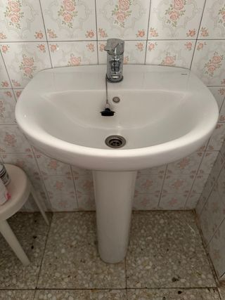 Lavabo roca de baño de cerámica y grifo incluido
