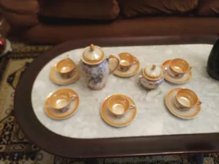 Juego de café de porcelana con pájaros