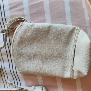 Portachupete, cambiador y portabiberón