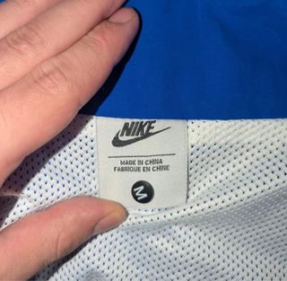Chaqueta cortavientos Nike azul y blanco
