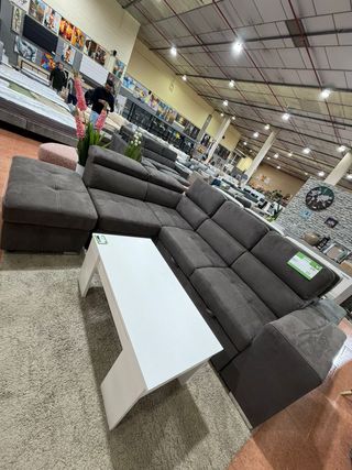 Sofá cama rinconera gris con puff arcón