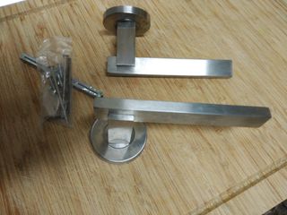 Manivela puerta de paso, de roseta. Acero