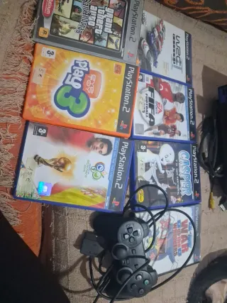 Consola PlayStation 2 con juegos