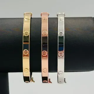 PULSERA RIGIDA TORNILLO ORO ROSA. Hueca. Oro 18k.