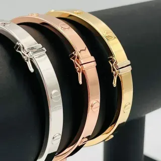 PULSERA RIGIDA TORNILLO ORO ROSA. Hueca. Oro 18k.