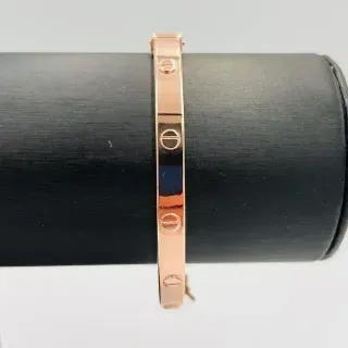 PULSERA RIGIDA TORNILLO ORO ROSA. Hueca. Oro 18k.