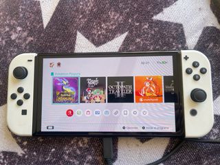 Nintendo Switch OLED + Pokémon Púrpura