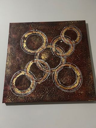 Cuadro brillante con aros dorados