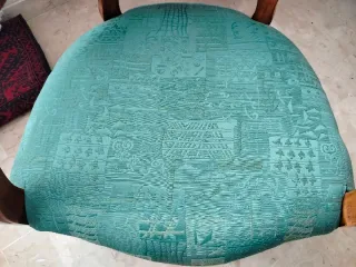 Poltrona antica verde in tessuto e legno