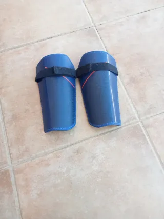 Botas de fútbol y espinilleras