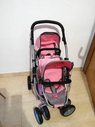 Carrito doble de muñecas rosa